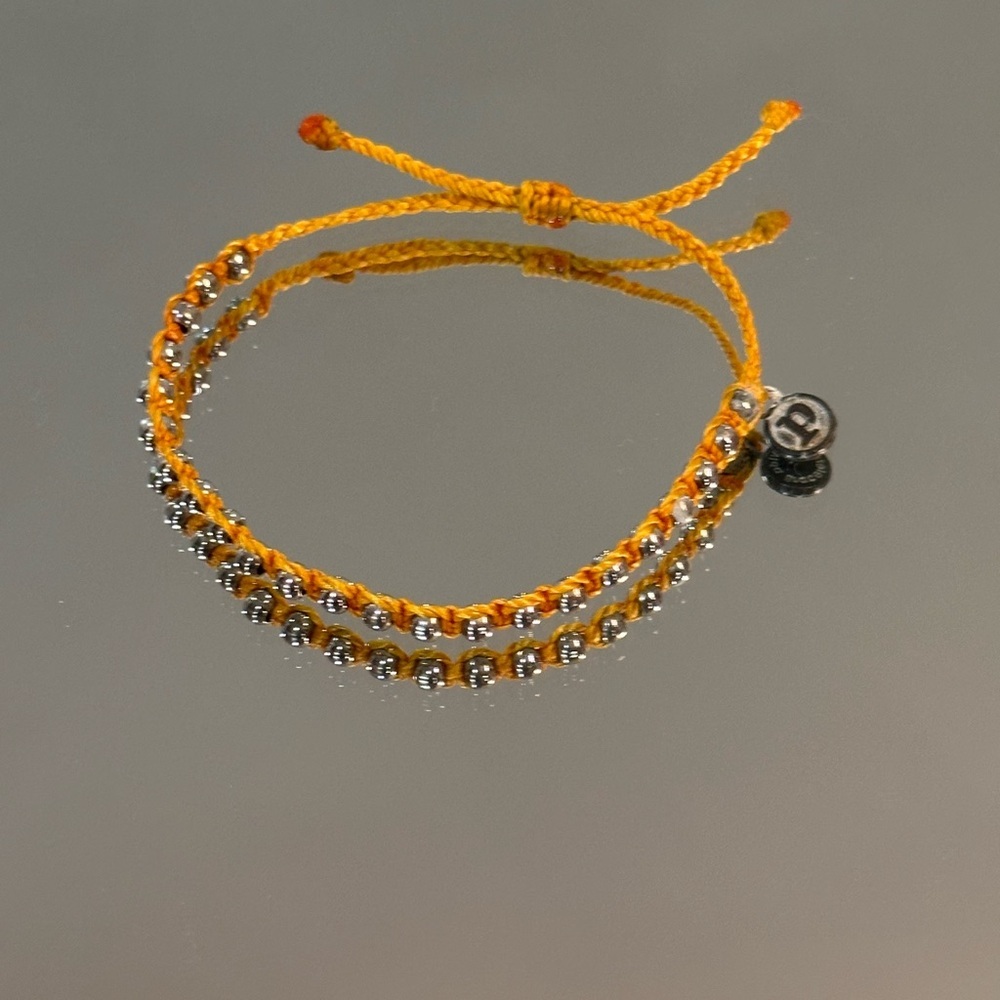 Pura Vida. Burnt Orange Braided Bracelet with Silver Beads